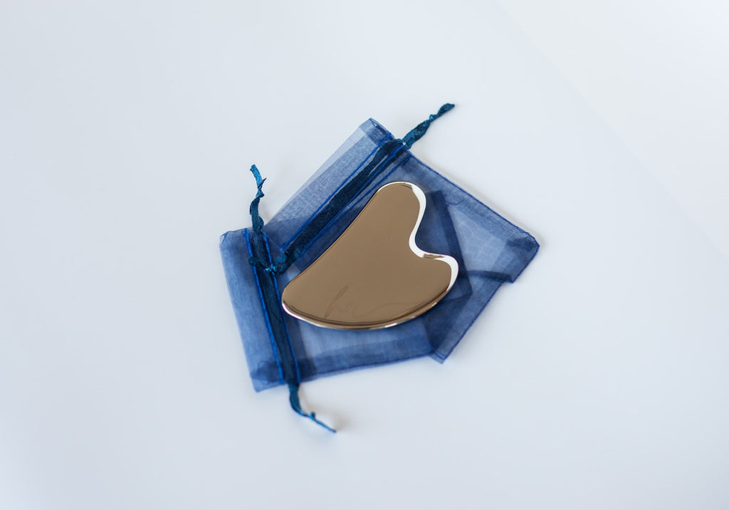 stainless steel gua sha, face tool, skincare routine, lymphatic drainage, facial sculpting