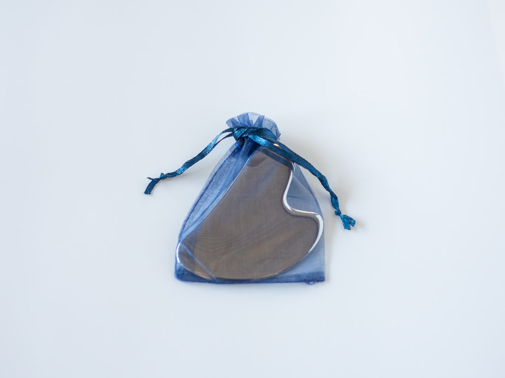 stainless steel gua sha, face tool, skincare routine, lymphatic drainage, facial sculpting